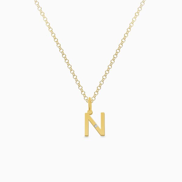 Dije en oro amarillo de 18K letra N moderna con brillante Sale